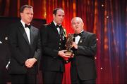 16 October 2009; Dermot Earley, of Kildare, is presented with his GAA Football All-Star award by Uachtarán CLG Criostóir Ó Cuana and Charles Butterworth, CEO Vodafone Ireland, during the 2009 GAA All-Stars Awards, sponsored by Vodafone. Citywest Hotel, Conference, Leisure & Golf Resort, Dublin. Picture credit: Ray McManus / SPORTSFILE
