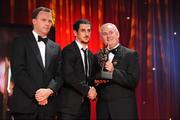 16 October 2009; Paul Galvin, of Kerry, is presented with his GAA Football All-Star award by Uachtarán CLG Criostóir Ó Cuana and Charles Butterworth, CEO Vodafone Ireland, during the 2009 GAA All-Stars Awards, sponsored by Vodafone. Citywest Hotel, Conference, Leisure & Golf Resort, Dublin. Picture credit: Ray McManus / SPORTSFILE