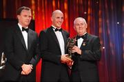 16 October 2009; Tadhg Kennelly, of Kerry, is presented with his GAA Football All-Star award by Uachtarán CLG Criostóir Ó Cuana and Charles Butterworth, CEO Vodafone Ireland, during the 2009 GAA All-Stars Awards, sponsored by Vodafone. Citywest Hotel, Conference, Leisure & Golf Resort, Dublin. Picture credit: Ray McManus / SPORTSFILE