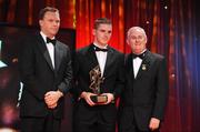 16 October 2009; Daniel Goulding, of Cork, is presented with his GAA Football All-Star award by Uachtarán CLG Criostóir Ó Cuana and Charles Butterworth, CEO Vodafone Ireland, during the 2009 GAA All-Stars Awards, sponsored by Vodafone. Citywest Hotel, Conference, Leisure & Golf Resort, Dublin. Picture credit: Ray McManus / SPORTSFILE