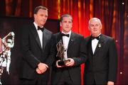 16 October 2009; Stephen O'Neill, of Tyrone, is presented with his GAA Football All-Star award by Uachtarán CLG Criostóir Ó Cuana and Charles Butterworth, CEO Vodafone Ireland, during the 2009 GAA All-Stars Awards, sponsored by Vodafone. Citywest Hotel, Conference, Leisure & Golf Resort, Dublin. Picture credit: Ray McManus / SPORTSFILE