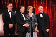 16 October 2009; Tommy Walsh, of Kilkenny, is presented with his GAA Hurler of the year All-Star award by President of Ireland Mary McAleese, Uachtarán CLG Criostóir Ó Cuana and Charles Butterworth, CEO Vodafone Ireland, during the 2009 GAA All-Stars Awards, sponsored by Vodafone. Citywest Hotel, Conference, Leisure & Golf Resort, Dublin. Picture credit: Ray McManus / SPORTSFILE