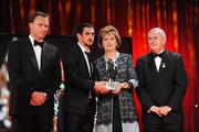 16 October 2009; Paul Galvin, of Kerry, is presented with his GAA Footballer of the Year All-Star award by President of Ireland Mary McAleese, Uachtarán CLG Criostóir Ó Cuana and Charles Butterworth, CEO Vodafone Ireland, during the 2009 GAA All-Stars Awards, sponsored by Vodafone. Citywest Hotel, Conference, Leisure & Golf Resort, Dublin. Picture credit: Ray McManus / SPORTSFILE