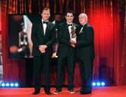 16 October 2009; Tom O'Sullivan, of Kerry, is presented with his GAA Football All-Star award by Uachtarán CLG Criostóir Ó Cuana and Charles Butterworth, CEO Vodafone Ireland, during the 2009 GAA All-Stars Awards, sponsored by Vodafone. Citywest Hotel, Conference, Leisure & Golf Resort, Dublin. Picture credit: Brendan Moran / SPORTSFILE
