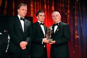 16 October 2009; Karl Lacey, of Donegal, is presented with his GAA Football All-Star award by Uachtarán CLG Criostóir Ó Cuana and Charles Butterworth, CEO Vodafone Ireland, during the 2009 GAA All-Stars Awards, sponsored by Vodafone. Citywest Hotel, Conference, Leisure & Golf Resort, Dublin. Picture credit: Ray McManus / SPORTSFILE