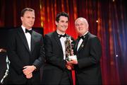 16 October 2009; Tom O'Sullivan, of Kerry, is presented with his GAA Football All-Star award by Uachtarán CLG Criostóir Ó Cuana and Charles Butterworth, CEO Vodafone Ireland, during the 2009 GAA All-Stars Awards, sponsored by Vodafone. Citywest Hotel, Conference, Leisure & Golf Resort, Dublin. Picture credit: Ray McManus / SPORTSFILE