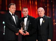 16 October 2009; Feargal O Se, of Kerry, accepts a GAA Football All-Star award, on behlaf of his brother Tomas, from Uachtarán CLG Criostóir Ó Cuana and Charles Butterworth, CEO Vodafone Ireland, during the 2009 GAA All-Stars Awards, sponsored by Vodafone. Citywest Hotel, Conference, Leisure & Golf Resort, Dublin. Picture credit: Ray McManus / SPORTSFILE