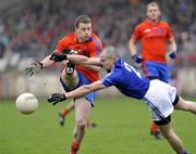 18 October 2009; Fabian O'Neill, Dromore, in action against Frank McGuigan, Ardboe. Tyrone County Senior Football Final, Dromore v Ardboe, Healy Park, Omagh, Co. Tyrone. Picture credit: Michael Cullen / SPORTSFILE