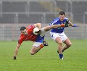 18 October 2009; Kyle Coney, Ardboe, in action against Conor O'Neill, Dromore. Tyrone County Senior Football Final, Dromore v Ardboe, Healy Park, Omagh, Co. Tyrone. Picture credit: Michael Cullen / SPORTSFILE