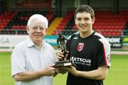 12 September 2006; Derry City's Kevin Deery is presented with the the eircom / Soccer Writers Association of Ireland Player of the Month award for August by Hugh McDaud, Chairman of Derry City FC. Brandywell, Derry. Picture credit: Lorcan Doherty / SPORTSFILE