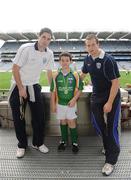 28 September 2009; 288 children from all over the country togged out today in the world-famous Croke Park stadium to attend the Vhi GAA Cúl Day Out. The 288 children were the lucky winners in the competition which was open to 82,500 children who attended a Vhi GAA Cúl Camp during the summer. Pictured after receiving his medal is Brian Gallagher, from Kilcock, Co. Kildare, with Vhi GAA Cúl Camps Ambassadors Dublin footballer Ross McConnell, left, and Cavan footballer Nicholas Walsh. Croke Park, Dublin. Picture credit: Stephen McCarthy / SPORTSFILE
