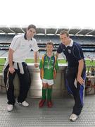 28 September 2009; 288 children from all over the country togged out today in the world-famous Croke Park stadium to attend the Vhi GAA Cúl Day Out. The 288 children were the lucky winners in the competition which was open to 82,500 children who attended a Vhi GAA Cúl Camp during the summer. Pictured after receiving his medal is Gearoid Daly, from Cloghan, Co. Offaly, with Vhi GAA Cúl Camps Ambassadors Dublin footballer Ross McConnell, left, and Cavan footballer Nicholas Walsh. Croke Park, Dublin. Picture credit: Stephen McCarthy / SPORTSFILE