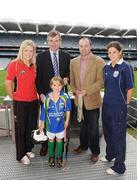 28 September 2009; 288 children from all over the country togged out today in the world-famous Croke Park stadium to attend the Vhi GAA Cúl Day Out. The 288 children were the lucky winners in the competition which was open to 82,500 children who attended a Vhi GAA Cúl Camp during the summer. Pictured after receiving her medal is Katie O'Byrne, from Aughrim, Co. Wicklow, with Vhi GAA Cúl Camps Ambassadors, from left, Cork ladies footballer Angela Walsh, former Meath footballer Colm O'Rourke, Dublin hurling manager Anthony Daly, and Wexford camogie player Mags D'Arcy. Croke Park, Dublin. Picture credit: Stephen McCarthy / SPORTSFILE