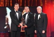 16 October 2009; Feargal O Se, on behalf of his brother Tomas O Sé, of Kerry, is presented with his GAA Football All-Star award by Uachtarán CLG Criostóir Ó Cuana and Charles Butterworth, CEO Vodafone Ireland, during the 2009 GAA All-Stars Awards, sponsored by Vodafone. Citywest Hotel, Conference, Leisure & Golf Resort, Dublin. Picture credit: Brendan Moran / SPORTSFILE