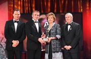 16 October 2009; Noel McGrath, of Tipperary, is presented with his GAA Young Hurler All-Star award by President of Ireland Mary McAleese, Uachtarán CLG Criostóir Ó Cuana and Charles Butterworth, CEO Vodafone Ireland, during the 2009 GAA All-Stars Awards, sponsored by Vodafone. Citywest Hotel, Conference, Leisure & Golf Resort, Dublin. Picture credit: Brendan Moran / SPORTSFILE