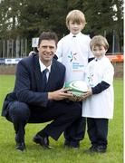19 October 2009; Sunderland chairman and former Republic of Ireland international Niall Quinn with Brian, age 10, and Tom Maye, age 5, at the launch of the Shane Geoghegan Trust. Garryowen Rugby Club, Limerick. Picture credit: Kieran Clancy / SPORTSFILE