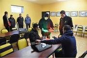 17 January 2016; Members of the match official team, from left to right, referee Kevin Murphy, Tipperary GAA administrator Jim O'Shea, assistant referee David Murnane and assistant referee John Ryan test their equipment in the Arravale Rovers clubhouse before the game. McGrath Cup Group A Round 3, Tipperary v Kerry. Sean Treacy Park, Tipperary. Picture credit: Diarmuid Greene / SPORTSFILE