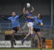 17 January 2016; Longford's Darren Gallaher fields a high ball under pressure from Dublin players Niall Scully, left, and Tomás Brady. Bord na Mona O'Byrne Cup Semi-Final, Longford v Dublin. Glennon Brothers Pearse Park, Longford. Picture credit: Ray McManus / SPORTSFILE