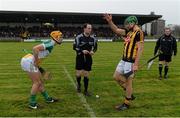 17 January 2016; Kilkenny captain Michael Malone, pictured with Offaly captain Conor Doughan and referee Alfie Devine, signals which way his team will play after winning the pre-match coin toss. Bord na Mona Walsh Cup Group 1, Offaly v Kilkenny. St Brendan's Park, Birr, Co. Offaly. Picture credit: Piaras Ó Mídheach / SPORTSFILE