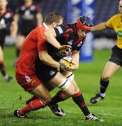 23 October 2009; Edinburgh's Scott Newlands is wrapped up by Thomas O'Leary, Munster. Celtic League, Edinburgh v Munster, Murrayfield Stadium, Edinburgh, Scotland. Picture credit: Dave Gibson / SPORTSFILE