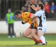 25 October 2009; Padraig O'Neill, St. Laurence's, in action against Thomas Deehan, Clara. AIB Leinster Club Senior Football Championship First Round, St. Laurence's v Clara, St. Conleth's Park, Newbridge, Co. Kildare. Picture credit: Pat Murphy / SPORTSFILE