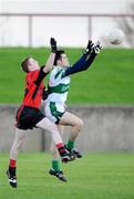 25 October 2009; Malachy McNulty, Portlaoise, in action against Keith Hamill, Mattock Rangers. AIB Leinster Club Senior Football Championship First Round, Mattock Rangers v Portlaoise, Drogheda, Co. Louth. Photo by Sportsfile
