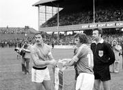 30 March 1977; Republic of Ireland captain John Giles, right, with France captain Christian Lopez and referee Mr. Linmayer, Austria, ahead of the game. World Cup Qualifier, Republic of Ireland v France, Lansdowne Road, Dublin. Picture credit: Connolly Collection / SPORTSFILE