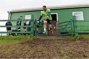 19 January 2016; Connacht's Bundee Aki jumps over a muddy area, at the entrance to the training pitch, before the start of squad training. Sportsground, Galway. Picture credit: David Maher / SPORTSFILE