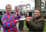 21 January 2016; Jockey Robbie Power, left, and trainer Willie Burke pose with the trophy after winning the Goffs Thyestes Handicap Steeplechase with My Murphy. Gowran Park, Gowran, Co. Kilkenny. Picture credit: Seb Daly / SPORTSFILE