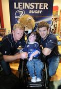 29 October 2009; Leinster's Leo Cullen and Gordon D'Arcy with John Paul Byrne, from Dublin, at the launch of Leinster's new Rugby Book entitled, Leinster, Conquering Europe, which follows the squad from the group stages, to the thrilling final against Leicester. Eason's, Dundrum Town Centre, Dublin. Picture credit: Pat Murphy / SPORTSFILE