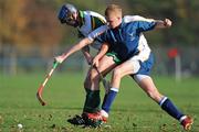 31 October 2009; Andrew Collier, Ireland, in action against Roddy MacDonald, Scotland. Under 21 Hurling/Shinty International, Scotland v Ireland, Bught Park, Inverness, Scotland. Photo by Sportsfile