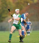 31 October 2009; Gareth Johnston, Ireland, in action against Alan MacKenzie, Scotland. Hurling/Shinty International, Scotland v Ireland, Bught Park, Inverness, Scotland. Photo by Sportsfile