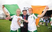 31 October 2009; Ireland players Sharon McQuillan, left, and Niamh Connolly, celebrate at the end of the game with Peter Keown from Wicklow. Camogie/Shinty International, Scotland v Ireland, Bught Park, Inverness, Scotland. Photo by Sportsfile