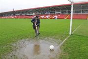 1 November 2009; Seamus Mullan, Chairman of Celtic Park, grounds committee, spikes the water logged pitch at Celtic Park. AIB GAA Football Ulster Senior Club Championship Quarter-Final, Loup v Derrygonnelly, Celtic Park, Derry, Co. Derry. Picture credit: Oliver McVeigh / SPORTSFILE