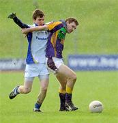 1 November 2009; Gordon Beggy, Wolfe Tones, in action against Bryan Clarke, Senechalstown. Meath County Senior Football Final, Wolfe Tones v Senechalstown, Páirc Tailteann, Navan. Picture credit: Ray Lohan / SPORTSFILE