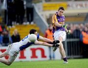 1 November 2009; Cian Ward, Wolfe Tones, in action against Andrew Collins, Senechalstown. Meath County Senior Football Final, Wolfe Tones v Senechalstown, Páirc Tailteann, Navan. Picture credit: Ray Lohan / SPORTSFILE