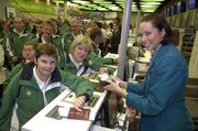 27 September 2007; On their way! Members of the Golf team Ruth O'Mahoney, from Blackrock, Co. Cork, left, and Rosaleen Moore, from Pouladuff, Co. Cork, are checked in by Aer Lingus member of staff Mary Kate McGovern at Dublin Airport prior to boarding Aer Lingus sponsored flight to London Heathrow en route to the Special Olympics World Summer Games. The 2007 Special Olympics World Summer Games will take place in Shanghai from the 2nd October to the 11th October 2007. Ireland will be represented by a team of 143 athletes and 55 coaches who will participate in 11 sports. Dublin Airport, Dublin. Picture credit: Brian Lawless / SPORTSFILE