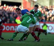 17 February 2001; Olivier Magne of France is tackled by Ireland's David Wallace with the support of team-mate Ronan O'Gara, right, during the Lloyds TSB Six Nations Rugby Championship match between Ireland and France at Lansdowne Road in Dublin. Photo by Brendan Moran/Sportsfile