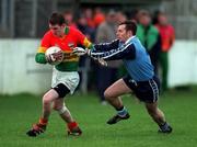 16 January 1999. Mark Carpenter of Carlow in action against Tom Lynch of Dublin during the O'Byrne Cup Quarter-Final match between Carlow and Dublin at Dr Cullen Park in Carlow. Photo by Ray McManus/Sportsfile