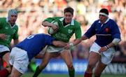 17 February 2001; Ireland's Ronan O'Gara is tackled by Olivier Magne of France during the Lloyds TSB Six Nations Rugby Championship match between Ireland and France at Lansdowne Road in Dublin. Photo by Brendan Moran/Sportsfile