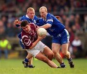 18 February 2001; Enda Lavelle of Crossmolina gets through the tackle of Bellaghy's Gareth Doherty and Peter Diamond during the AIB All-Ireland Senior Club Football Championship Semi-Final match between Crossmolina Deel Rovers and Bellaghy Wolfe Tones at Brewster Park in Enniskillen, Fermanagh. Photo by Ray McManus/Sportsfile