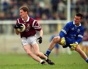 18 February 2001; James Nallen of Crossmolina gets through the tackle of Bellaghy's Cathal Scullion during the AIB All-Ireland Senior Club Football Championship Semi-Final match between Crossmolina Deel Rovers and Bellaghy Wolfe Tones at Brewster Park in Enniskillen, Fermanagh. Photo by Ray McManus/Sportsfile
