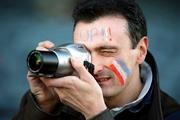 17 February 2001; A France supporter takes a photograph during the Lloyds TSB Six Nations Rugby Championship match between Ireland and France at Lansdowne Road in Dublin. Photo by Brendan Moran/Sportsfile