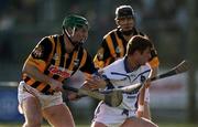 18 February 2001; Tony Browne of Waterford is tackled by Jimmy Coogan of Kilkenny  during the Allianz National Hurling League Division 1B match between Waterford and Kilkenny at Walsh Park in Waterford. Photo by Aoife Rice/Sportsfile
