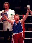 23 February 2001; James Moore of Arklow, Wicklow celebrates victory over Neil Gough, St Paul's, Waterford, following their welterweight final during the IABA Irish National Boxing Championship Finals at the National Stadium in Dublin. Photo by Damien Eagers/Sportsfile