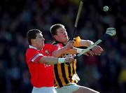 24 February 2001; Diarmuid O'Sullivan of Cork in action against Kilkenny's Tom Drennan during the Allianz National Hurling League Division 1B match between Cork and Kilkenny at Páirc Uí Chaoimh in Cork. Photo by Ray McManus/Sportsfile