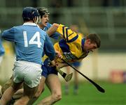 25 February 2001; Declan Murphy of Sixmilebridge is tackled by Dennis Byrne, 14, and James Young of Graigue Ballycallan during the AIB All-Ireland Senior Club Hurling Championship Semi-Final between Graigue Ballycallan and Sixmilebridge at Semple Stadium in Thurles, Tipperary. Photo by Brendan Moran/Sportsfile