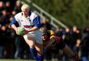24 February 2001; Mark McHugh of St Mary's College is tackled by Ronan Fallon of Lansdowne during the AIB All-Ireland League Division 1 match between St Mary's College RFC and Lansdowne RFC at Templeville Road in Dublin. Photo by Matt Browne/Sportsfile