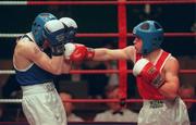 23 February 2001; John Paul Kinsella, St Fergal's, Wicklow, throws a right towards Paul Baker, Pegasus, Down, in their light flyweight final during the IABA Irish National Boxing Championship Finals at the National Stadium in Dublin. Photo by Damien Eagers/Sportsfile