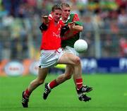 24 September 2000; James Masters of Cork is tackled by Dermot Geraghty of Mayo during the All Ireland Minor Football Championship Final match between Cork and Mayo at Croke Park in Dublin. Photo by Ray Lohan/Sportsfile